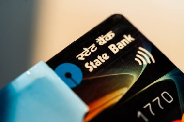 SBI Cards IPO concept. Macro closeup shot of debit or credit card for background. Concept for State Bank of India, indian economy, business & finance. clipart