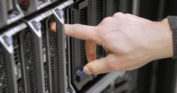 IT consultant power on a blade server in datacenter — Stock Photo, Image