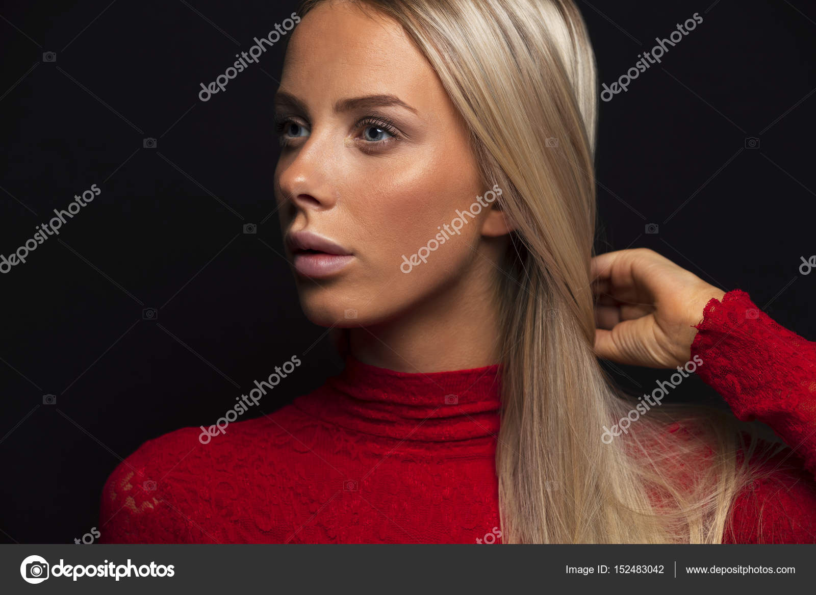 Dark Portrait Of A Beautiful Blonde Woman In Red Dress With Black