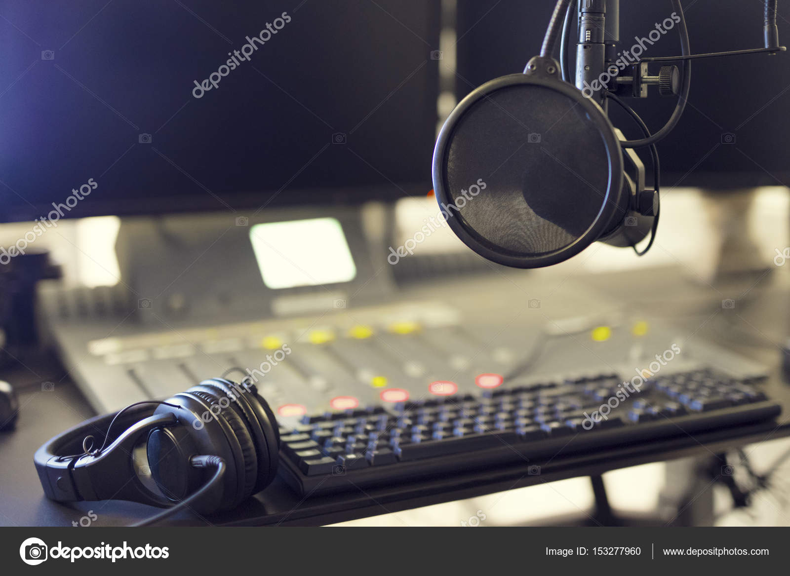 Microphone and headset in radio station broadcasting studio