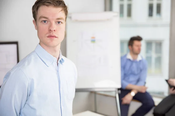 Confident Young Businessman Standing In Office — Stock Photo, Image