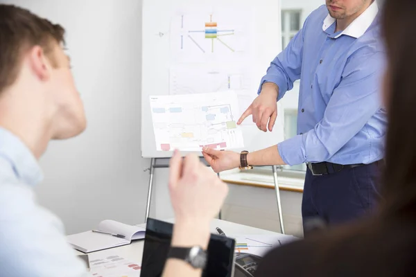 Professional Showing Chart To Colleagues In Office — Stock Photo, Image