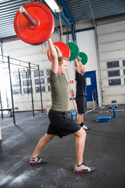 Male Athletes Lifting Weights In Health Club — Stock Photo, Image