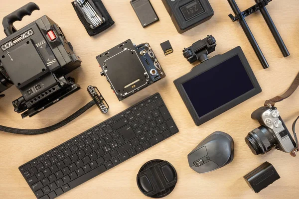 Directly above shot of computer parts and photographic equipment on table — Stock Photo, Image