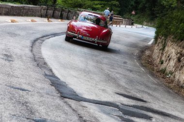GOLA DEL FURLO, ITALY - MAY 19: MERCEDES-BENZ 300 SL COUP W 198 1955 on an old racing car in rally Mille Miglia 2017 the famous italian historical race (1927-1957) on May 19 2017 clipart