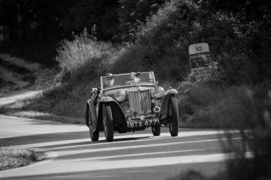 PESARO COLLE SAN BARTOLO , ITALY - MAY 17 - 2018 : MG TB 1939 on an old racing car in rally Mille Miglia 2018 the famous italian historical race (1927-1957) clipart