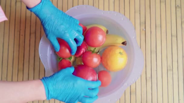 Woman Wearing Blue Latex Gloves Removing Plastic Basin Water Bleach — Stock Video