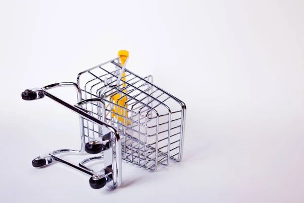 Fallen Shopping cart concept of ended shopping and sales, retail and shops. — 스톡 사진