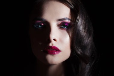 luxurious and mysterious beauty in Noir style, a portrait on a black background,