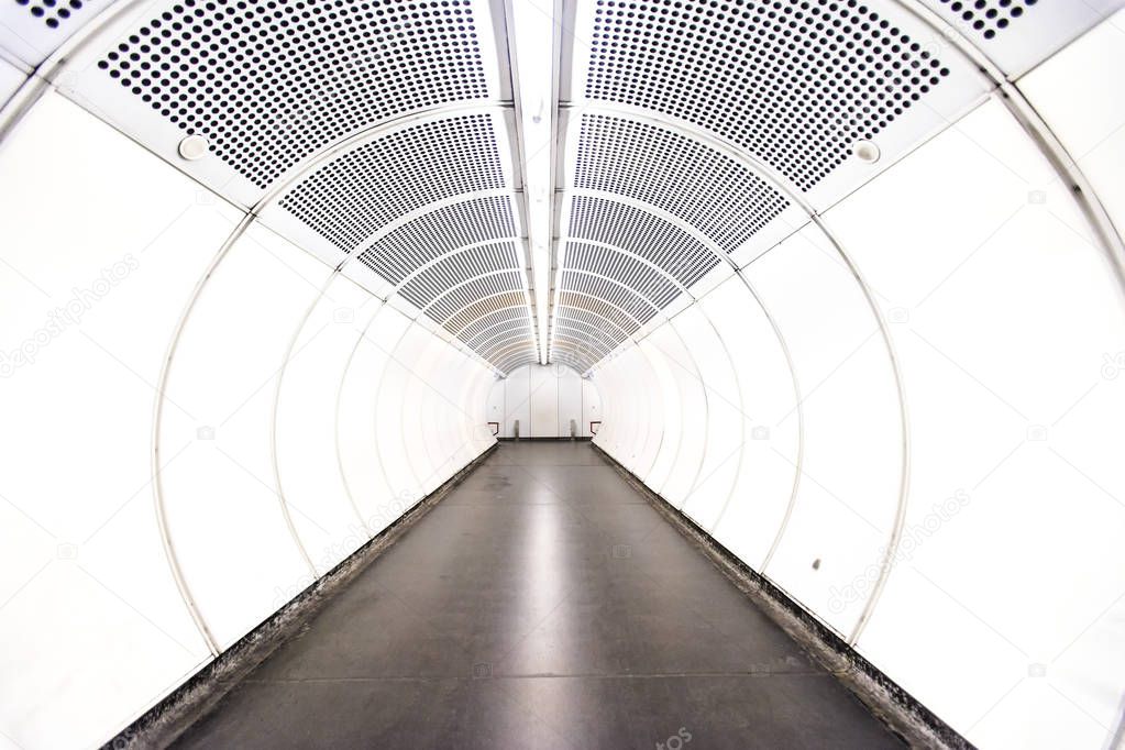 empty white underground metro tunnel 