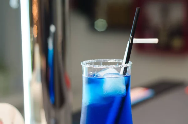 Blue cocktail on the bar. Stock Photo