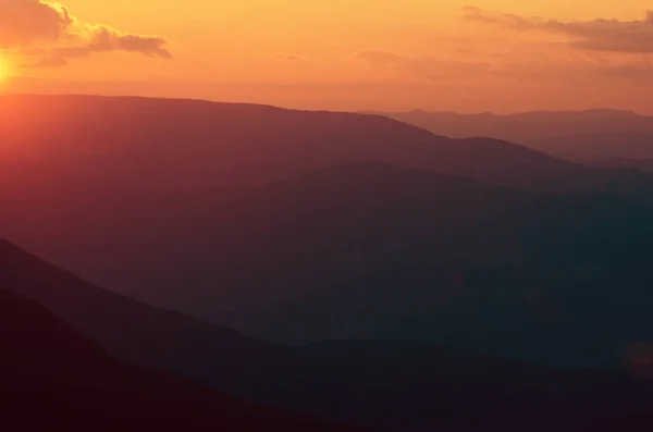 Sunset over mountains. — Stock Photo, Image