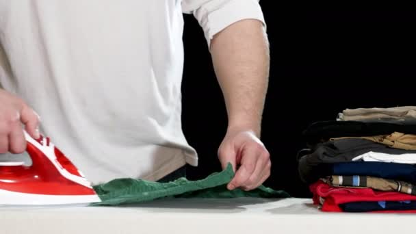 Mid section of man ironing clothes at home. 4k — Stock Footage Mid Section Man Ironing Clothes Home Stock Video