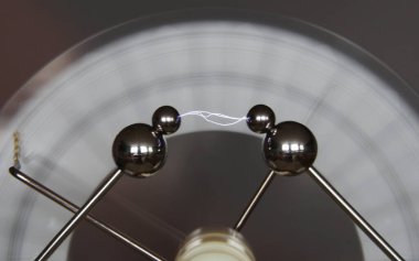 Small lightning discharge in a laboratory, caused by charge separation through a Wimshurst machine. Science experiment. clipart