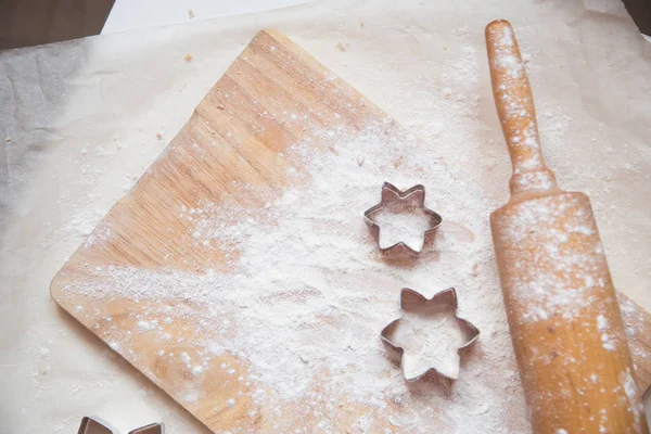 Dough beautiful cook cooking aesthetics. Celebration. New Year. Gingerbread, cookies. Crockery, recipe, kitchen. Cozy home cook at home eat home cooking utensils. Orange parchment. baking dish Moulds for cookies star puff pastry. flour  plunger