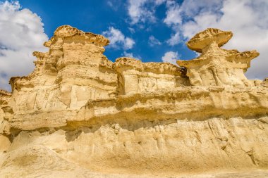 A view of the rock formations Erosions of Bolnuevo on the Mediterranean coast in Spain clipart