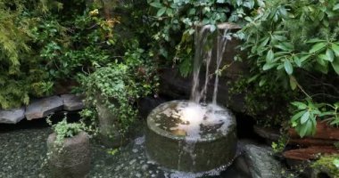 Decorative waterfall with splashing water stream
