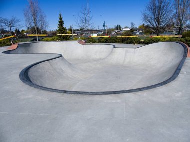 Empty skateboarding rink in Sidney BC boarded to prevent spread of infection during Covid-19 pandemic clipart