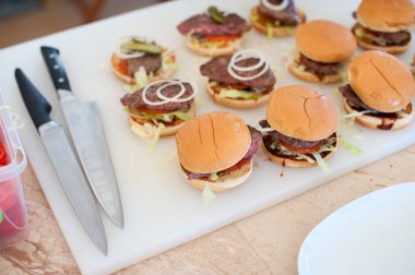 Ready-made homemade small burgers with grilled meatballs clipart