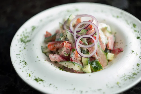 Vegetable salad in a white plate — Stock Photo, Image