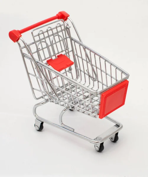 Small shopping trolley for shopping on a white background. The concept. Glyph of Purchase — Stock Photo, Image