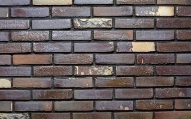 Dekoratif tuğla. Beyaz noktalar ile karanlık tuğla