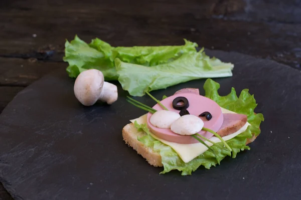Original children\'s sandwich in the form of a cute kitten. Original creative serving