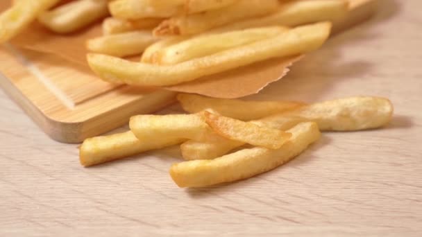 Panning View Deep Fried Golden Yummy French Fries Perchment Baking — Stockvideo