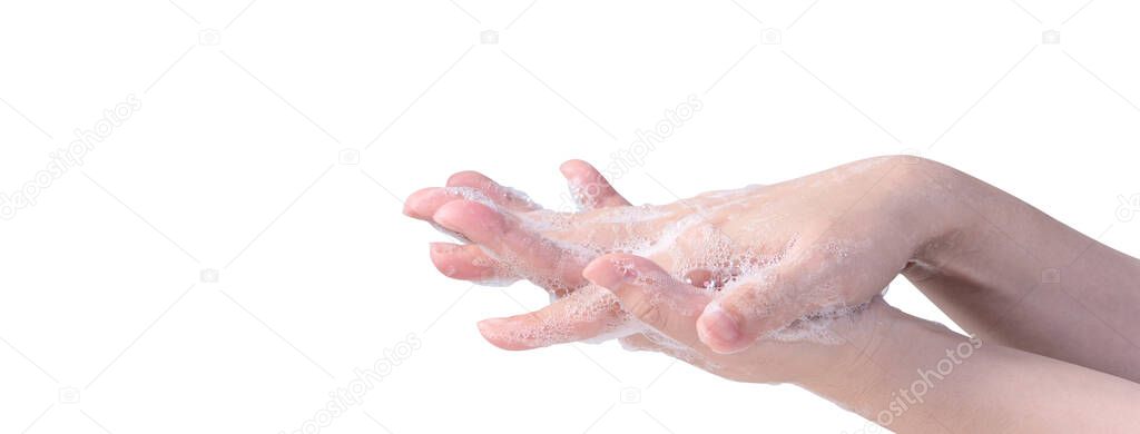 Washing hands isolated on white background. Asian young woman using liquid soap to wash hands, concept of protecting pandemic coronavirus, close up.
