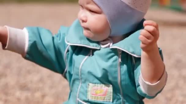 Baby Toddler Playing Sand Sandbox Rakes His Hands — Stock Video