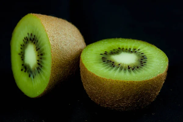 Kiwi fruit on black background