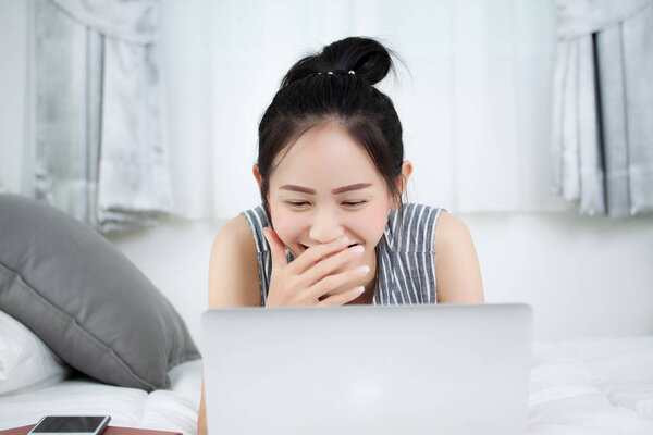 Asian woman working at home.