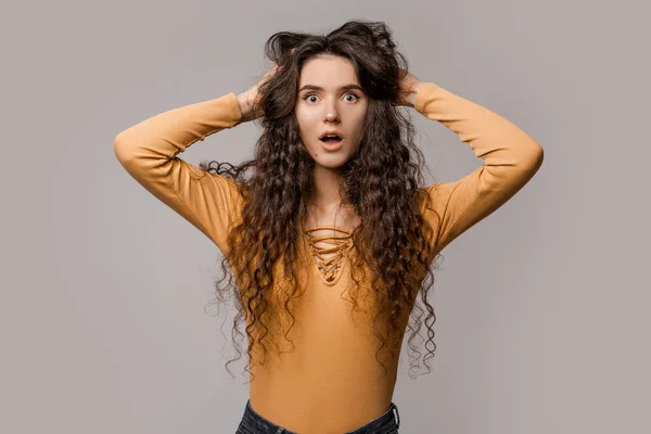 Shocked Frightened Perplexed Woman Magnificent Curly Hair Clutched Her Head — Stock Photo, Image