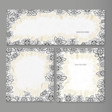 Üzerinde çiçekler ve gri arka planda altın bitkiler olan tebrik kartları.