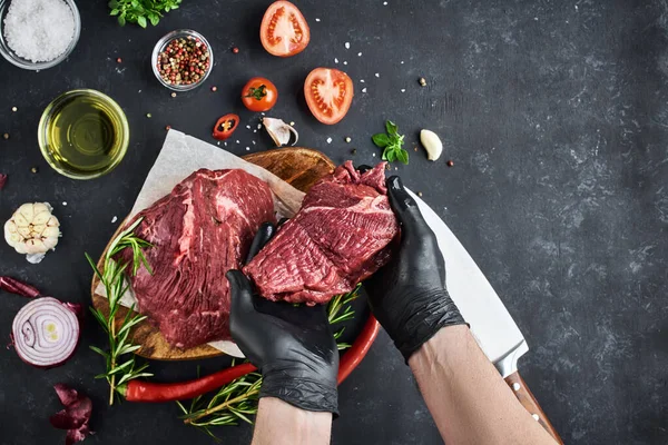 Butcher Shows Section Fresh Meat Tenderloin Which Lies Parchment Dark — Stock Photo, Image