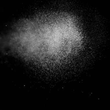 Kare siyah bir zemin üzerine su soyut sıçraması.