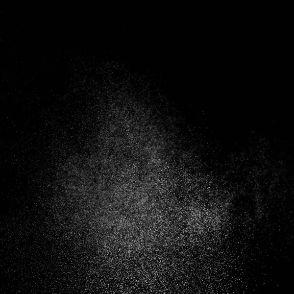 Kare siyah bir zemin üzerine su soyut sıçraması.