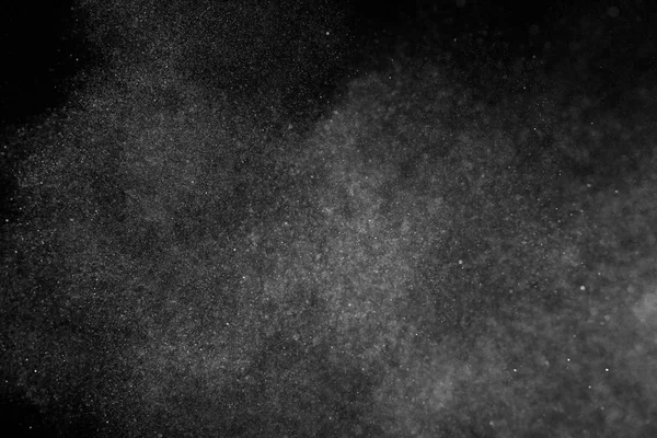 Freeze motion of white particles on black background. — Stock Photo, Image