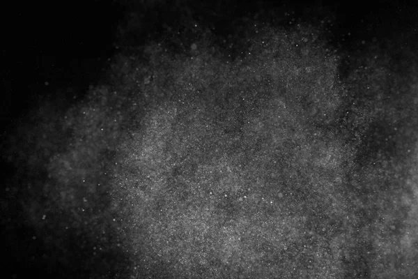 Congeler le mouvement des particules blanches sur fond noir . — Photo