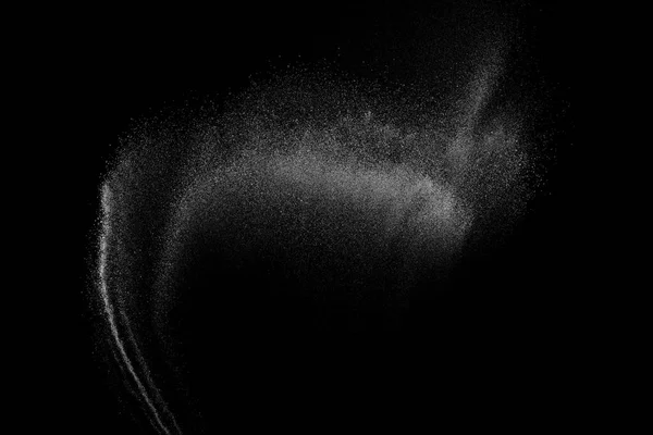 冻结在黑色背景上的白色粒子的运动. — 图库照片