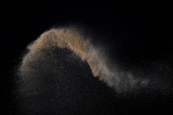 Sandy explosie geïsoleerd op zwarte achtergrond. — Stockfoto