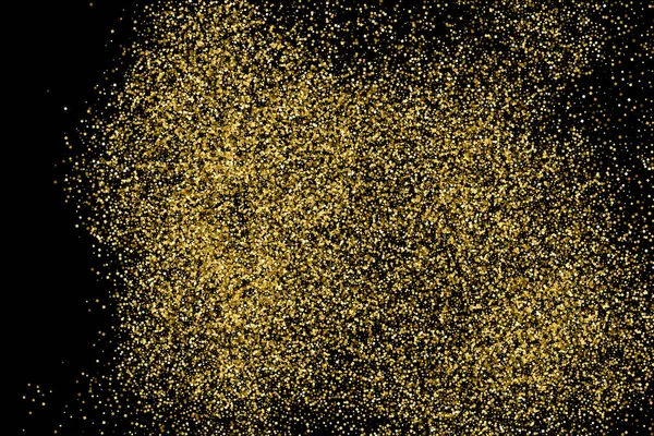 Gold glitter texture isolated on black. Amber particles color. Celebratory background. Golden explosion of confetti.