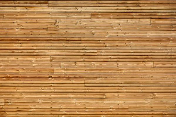 recycled wood strips forming a repetitive and decorative pattern