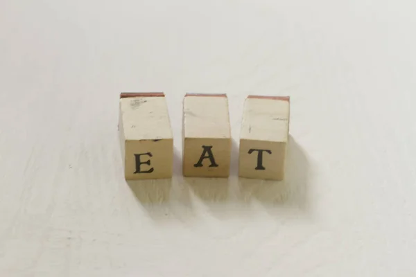 Brief blokken vormen het woord eten — Stockfoto