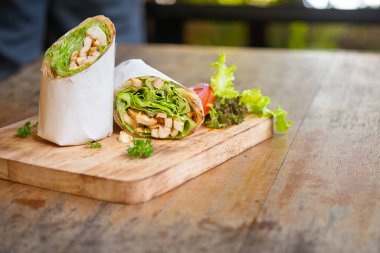 Wrap chicken or tasty kebab with vegetables 