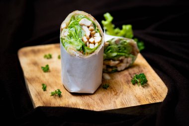 Wrap chicken or tasty kebab with vegetables 