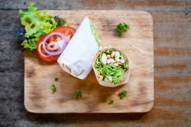 Wrap chicken or tasty kebab with vegetables 