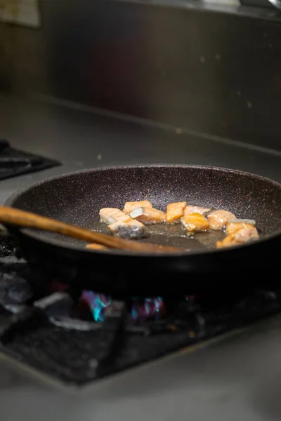 Cooking salmon.Salmon fry in pan — ストック写真