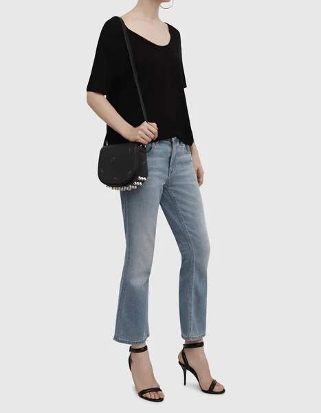 Women's Black Round Neck T-Shirt Half Sleeve, Natural Ground Silk Cotton Voile Schiffli Off Shoulder Top with blue jean, white background — Stock Photo, Image