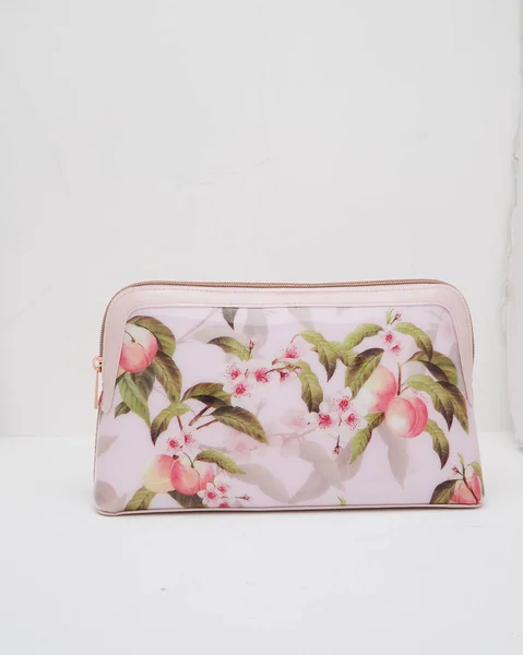 Elegant floral print pouch with white background